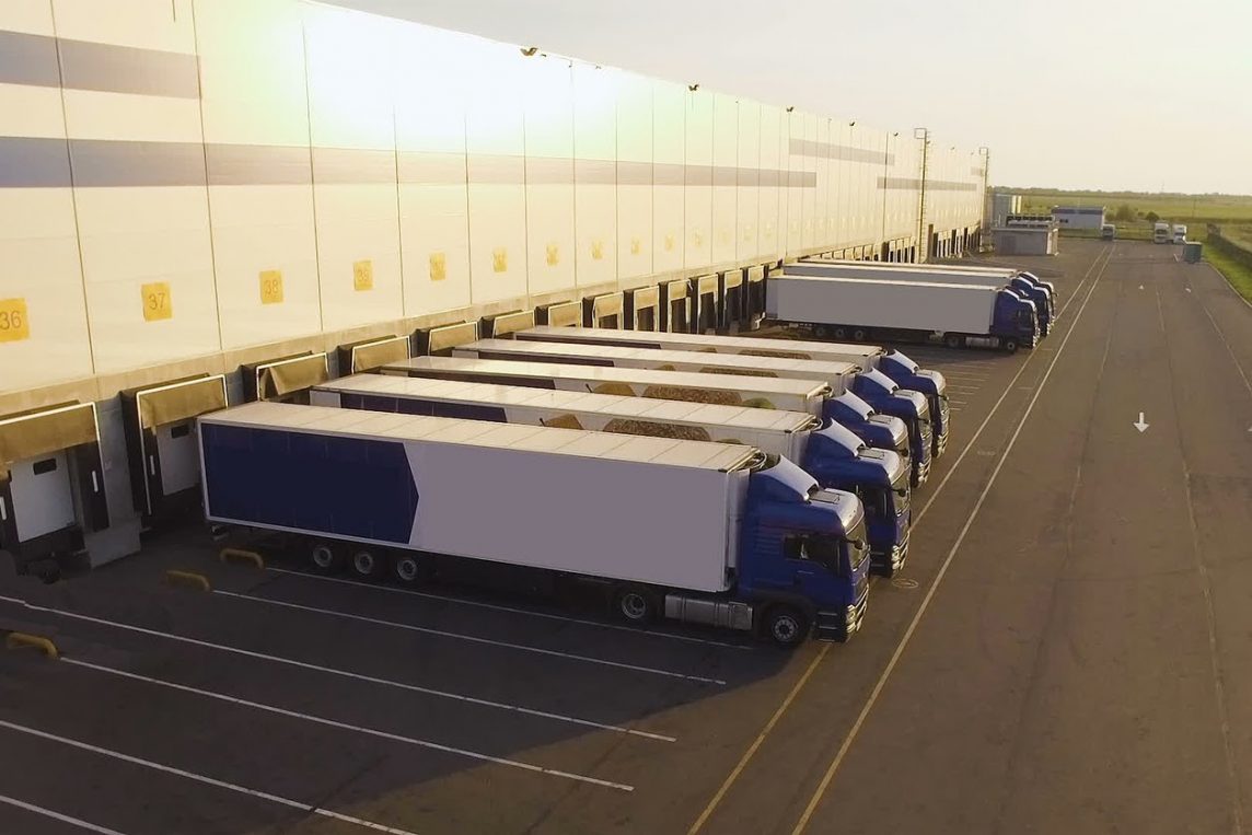 A distribution warehouse with trucks awaiting loading