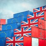 shipping containers with EU and British flags reflecting post-Brexit export and import restrictions
